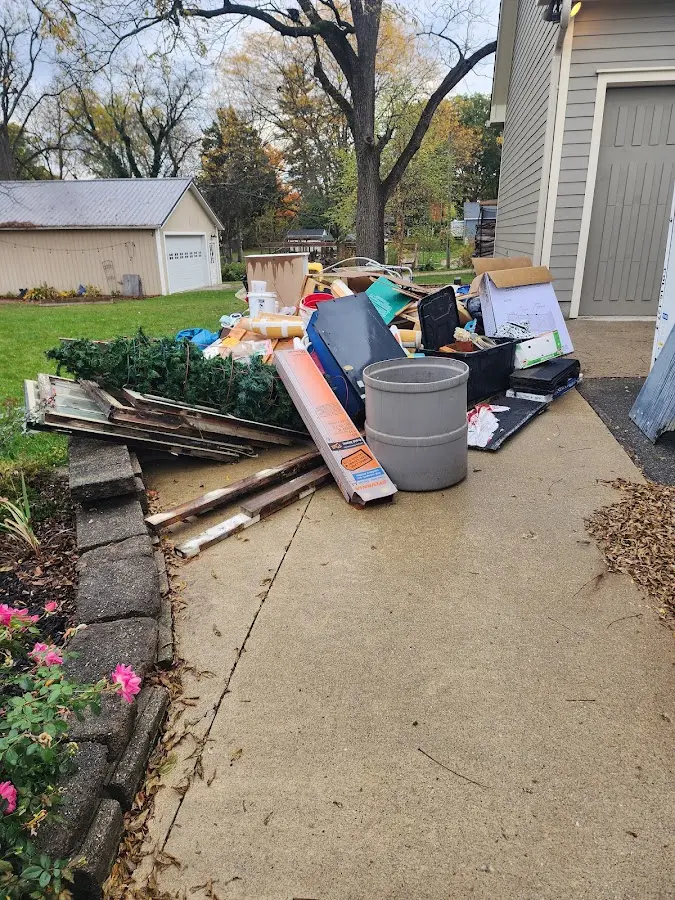 Dumpster being loaded with debris for Commercial Dumpster Rental in Anniston
